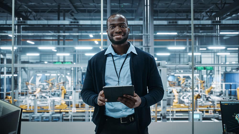 Portrait of Successful Engineer Using Tablet