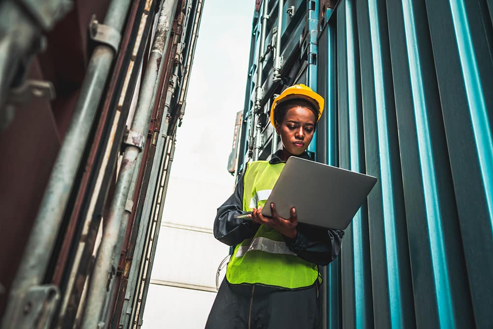 Woman worker at overseas shipping container yard